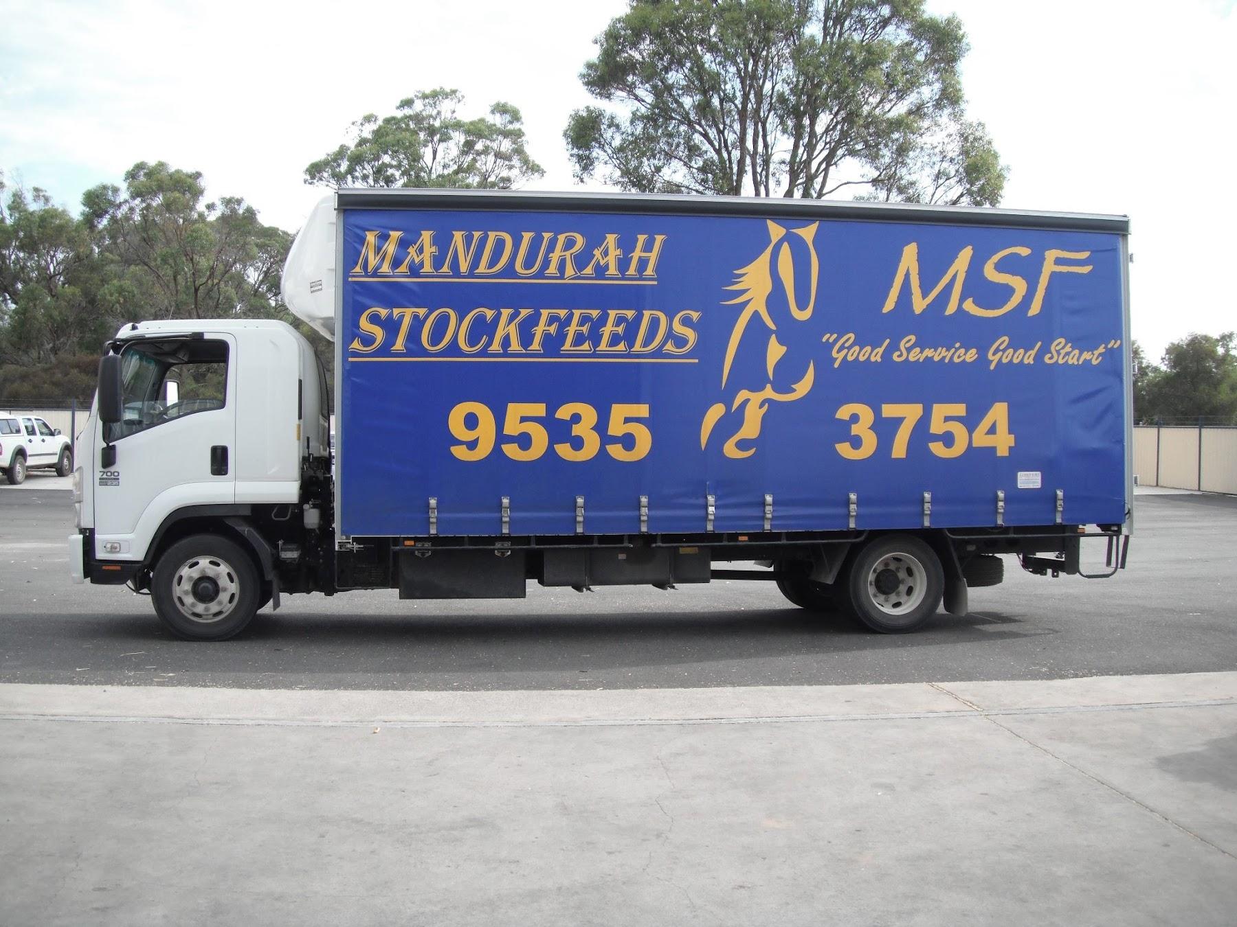 The Mandurah Stock Feeds delivery truck, painted with the slogan Good Service Good Start
